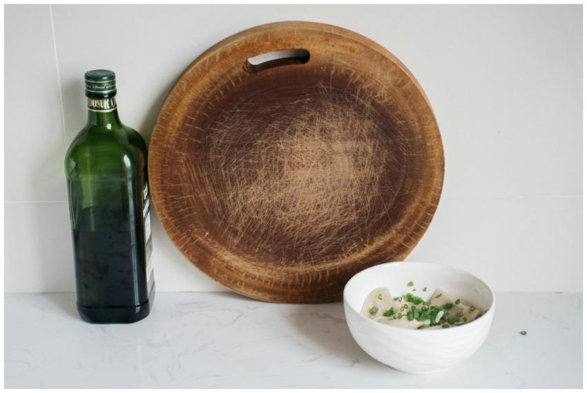 A rustic kitchen setup featuring dumplings in a bo