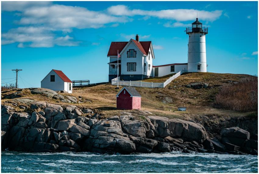 A scenic view of a classic New England lighthouse