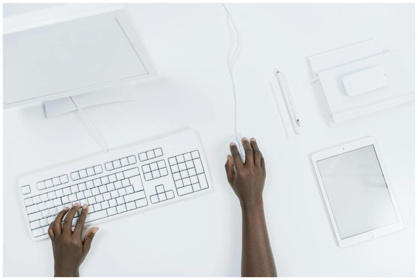 Top view of a minimalist workspace with a computer