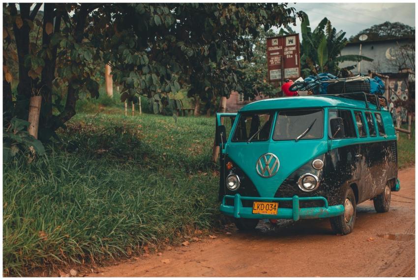 A classic Volkswagen van parked on a scenic rural