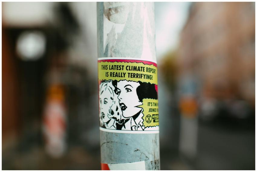 Sticker on pole with comic-style graphics raising