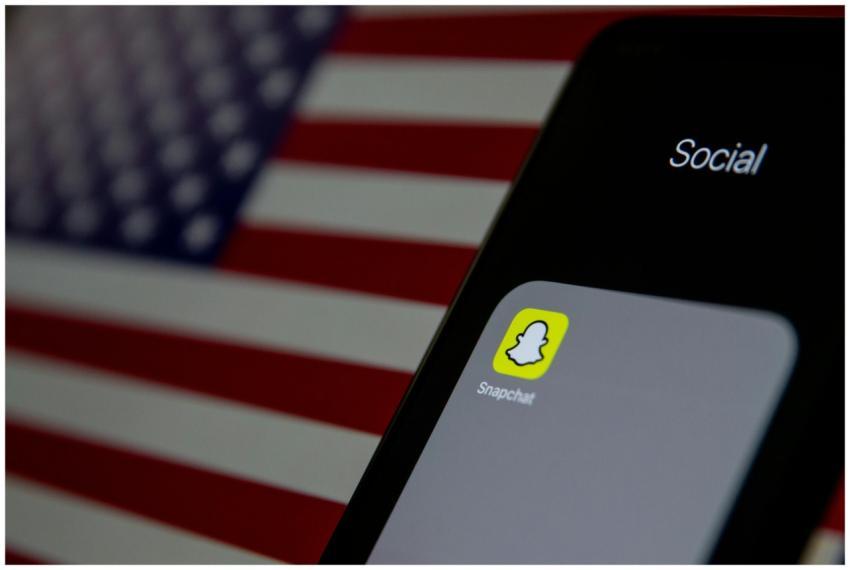 Close-up of a smartphone with Snapchat app icon, A