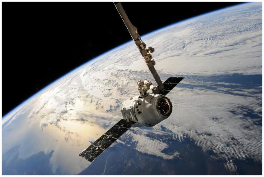 A satellite glides over Earth showcasing dramatic