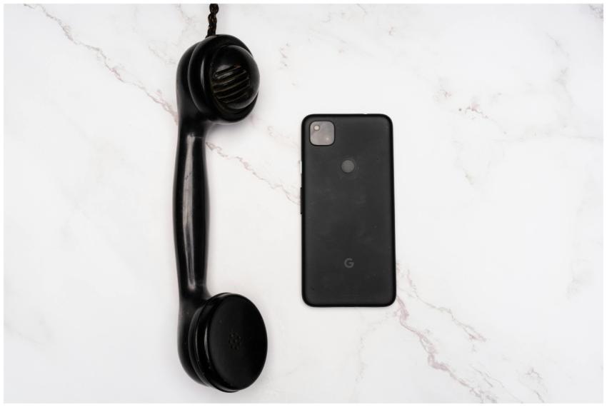 Contrasting an antique telephone receiver with a m