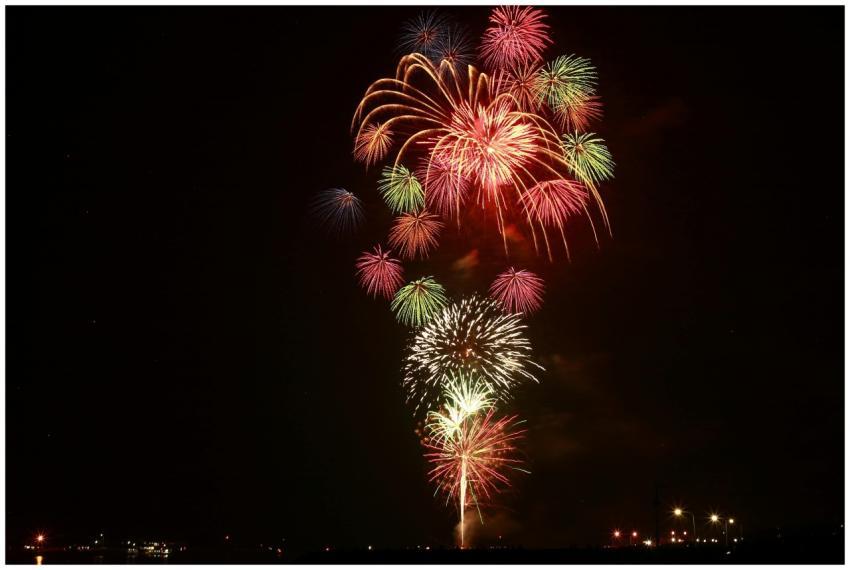Colorful fireworks exploding in the night sky duri