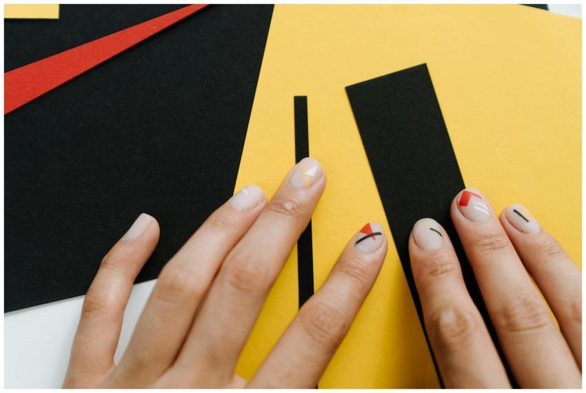 Close-up of modern nail art with geometric shapes