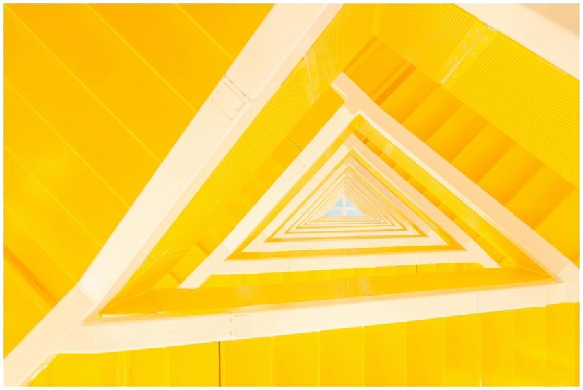 A modern abstract view of a yellow staircase with