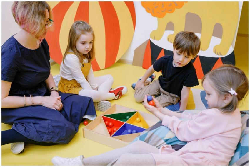 Children playing and learning with a teacher in a