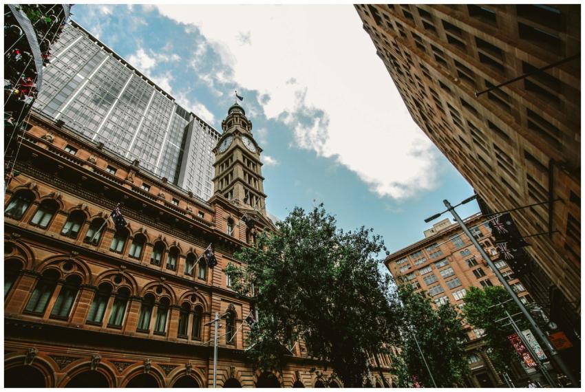 View of historic clock tower amidst urban building