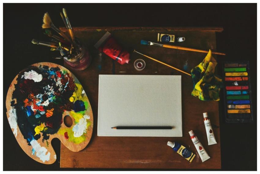 Vibrant artist workspace with paintbrushes, palett