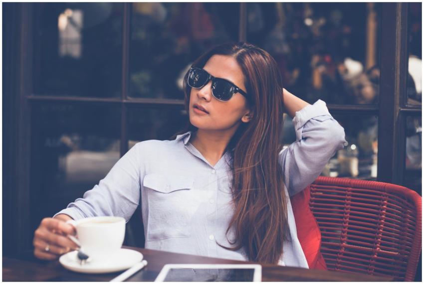 Woman enjoying a relaxed coffee break indoors with