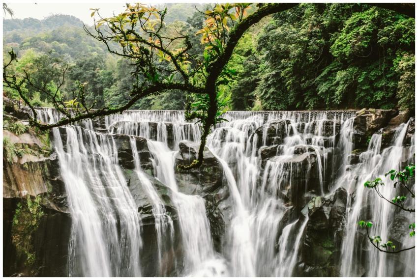 Capture of Shifen Waterfall in Taiwan, surrounded