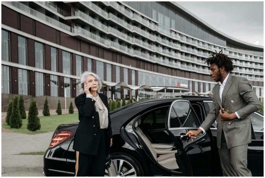 Senior female executive on phone with chauffeur ho