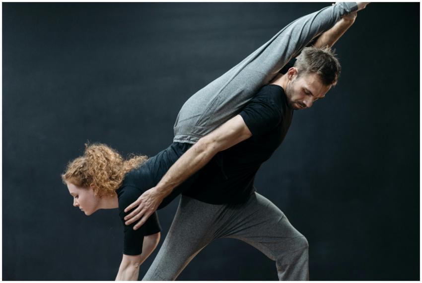 A male and female dancer in a dynamic pose during