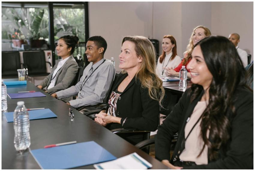 A diverse group attending a seminar in a professio