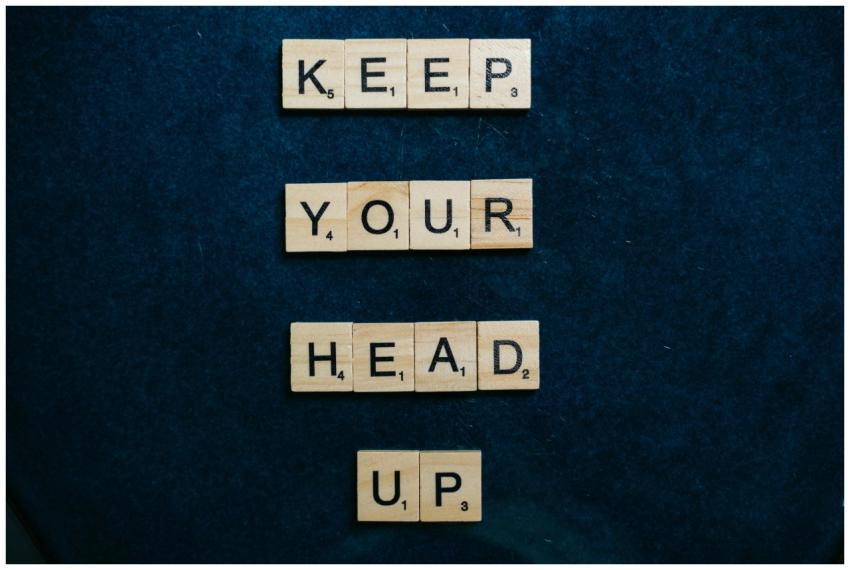 Inspirational message 'Keep Your Head Up' in Scrab