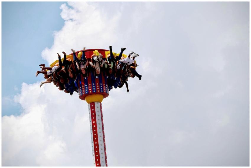 People enjoying an exhilarating amusement park rid