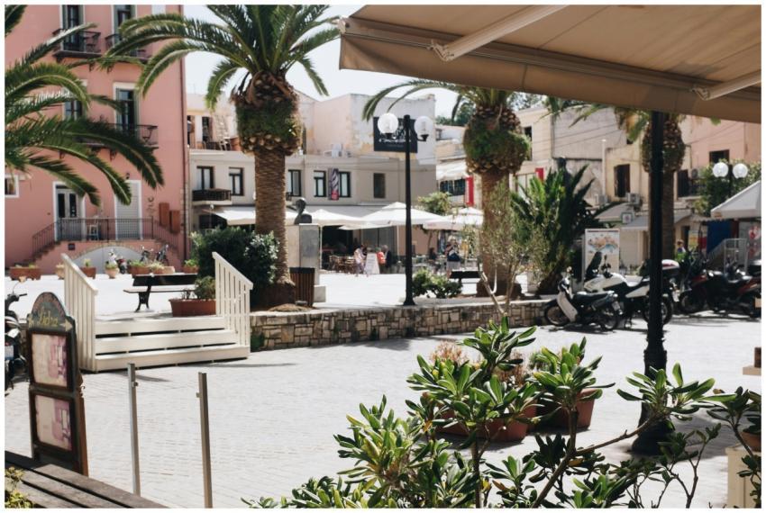 Vibrant square in Chania, Greece, showcasing palm