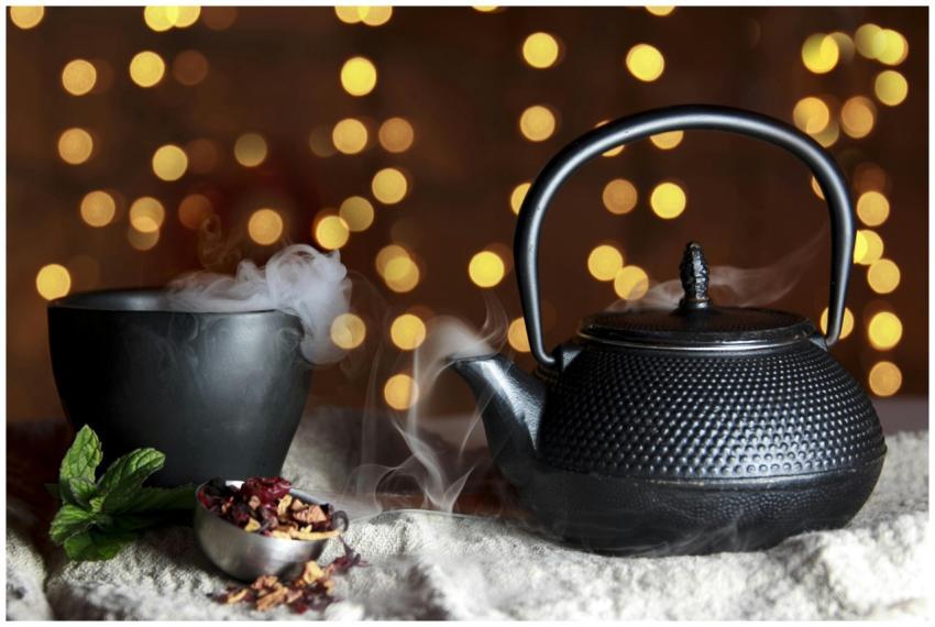 A serene still life of a black teapot and teacup w