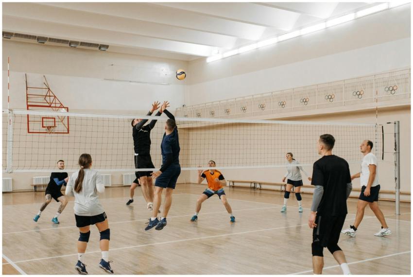 A dynamic indoor volleyball game with players in m