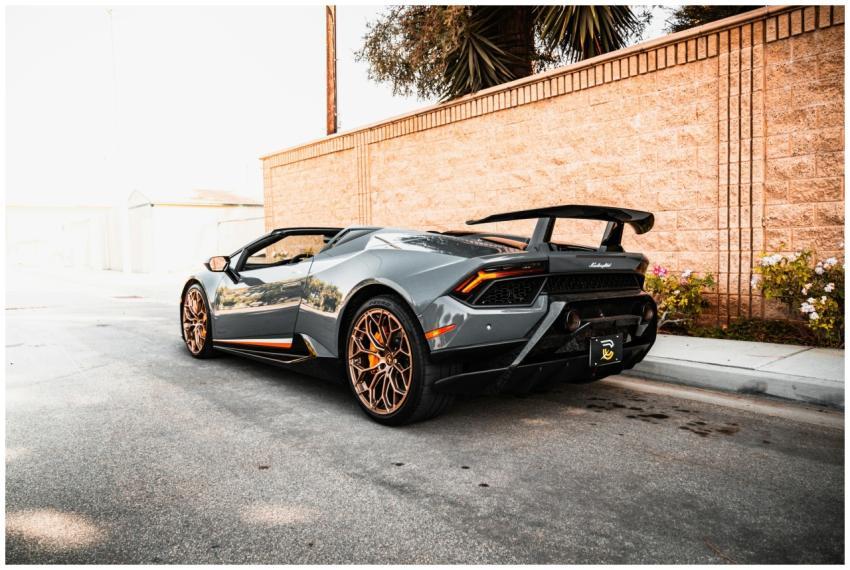 A sleek Lamborghini sports car parked in an urban