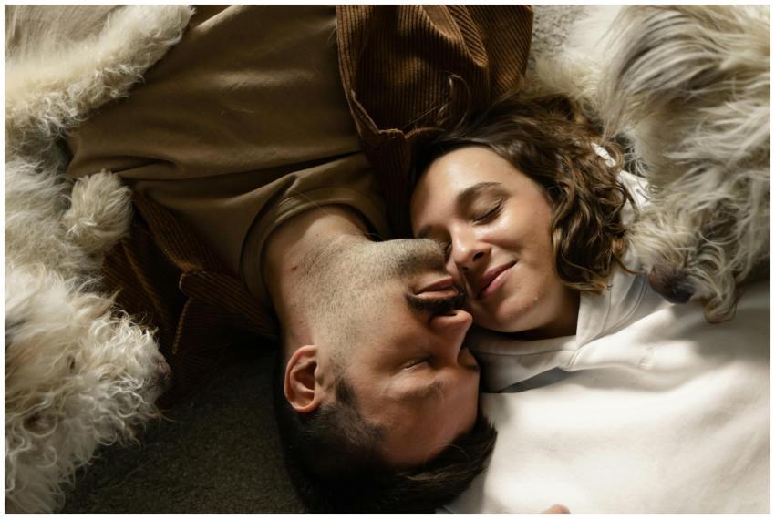 A loving couple enjoys a peaceful moment cuddled w