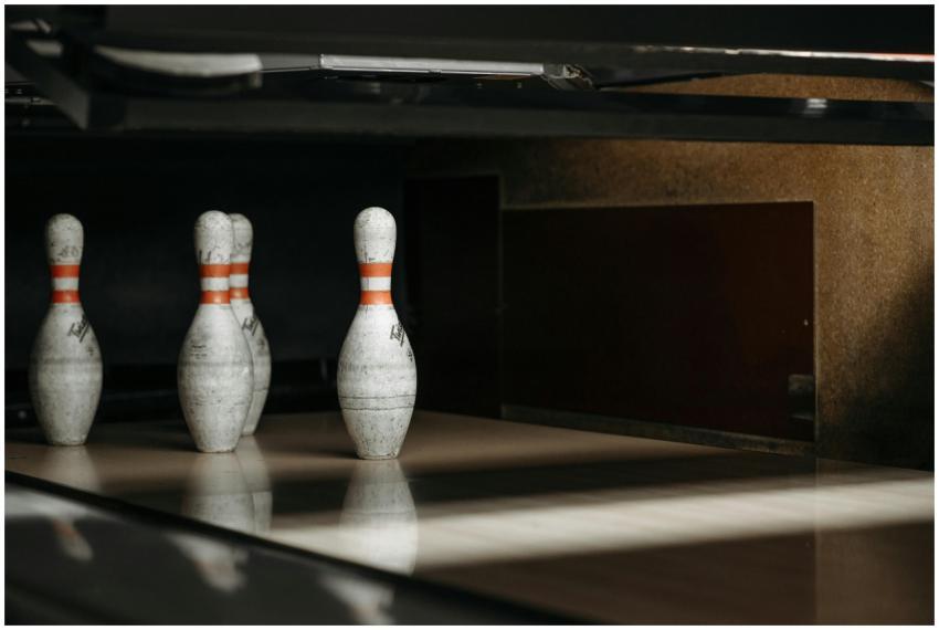 Focused shot of bowling pins in an alley showcasin