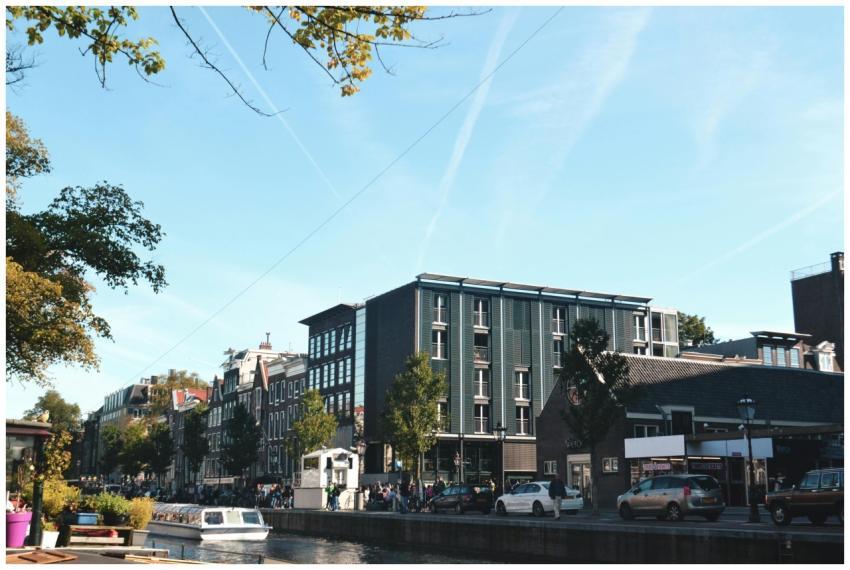 A vibrant cityscape of Amsterdam showcasing canals