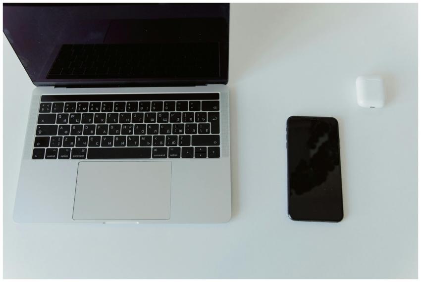 Modern minimalist workspace featuring a laptop, sm