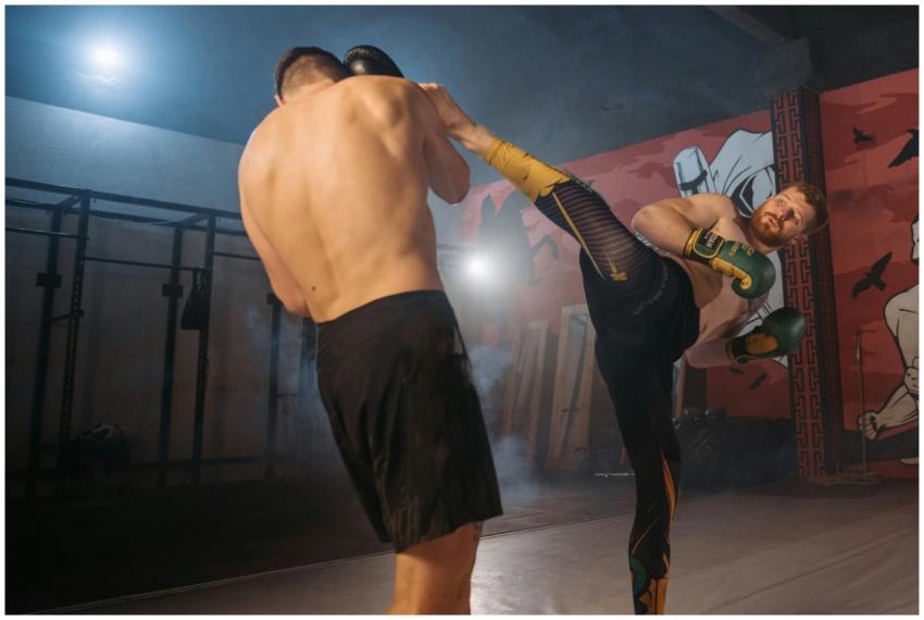 Two male athletes in intense martial arts training