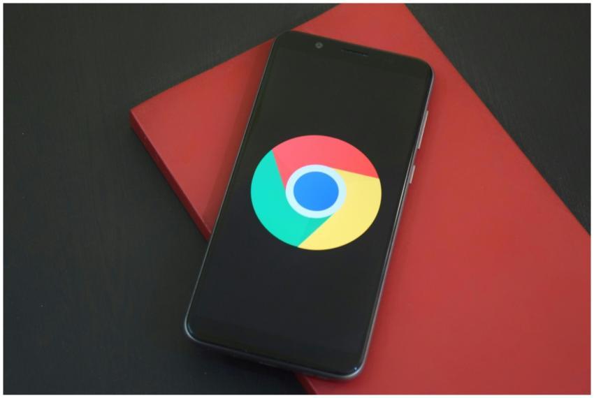 Close-up of a smartphone with Chrome browser logo