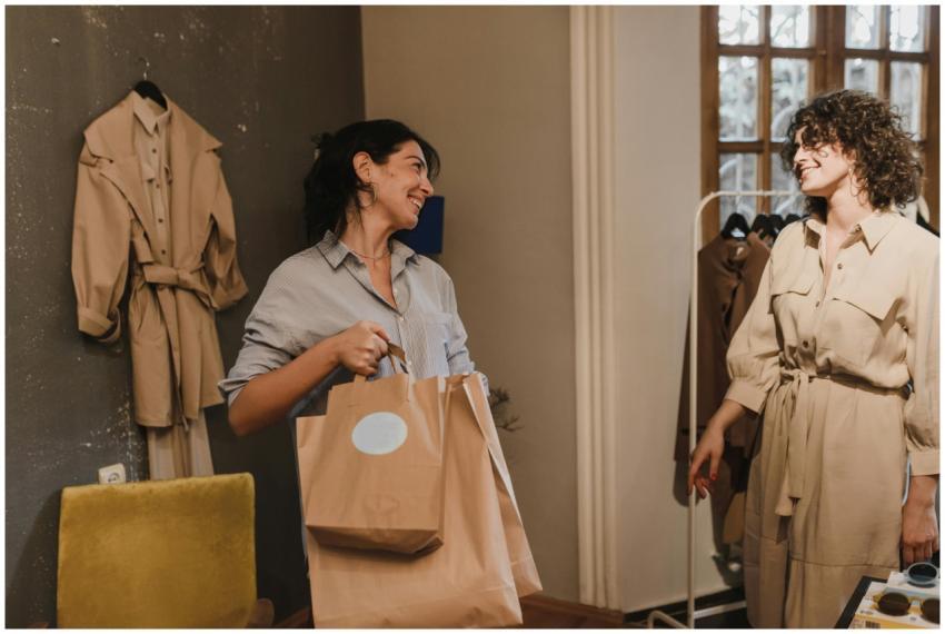 Two women enjoying a shopping experience in a bout