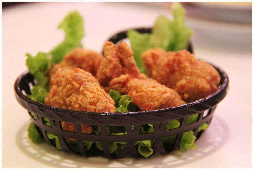 Close-up of crispy fried chicken served in a black