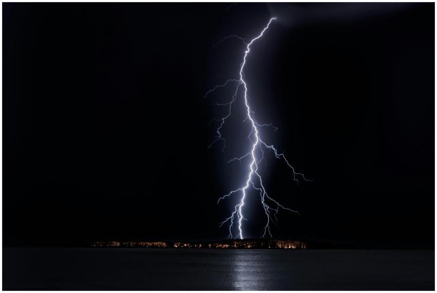 Stunning nighttime lightning bolt captured over oc