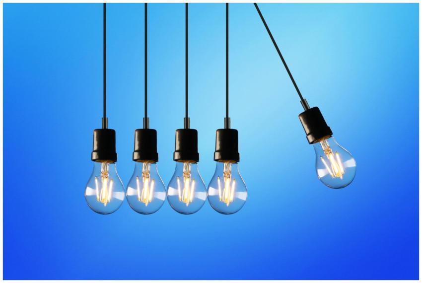 Hanging Edison-style light bulbs against a vibrant