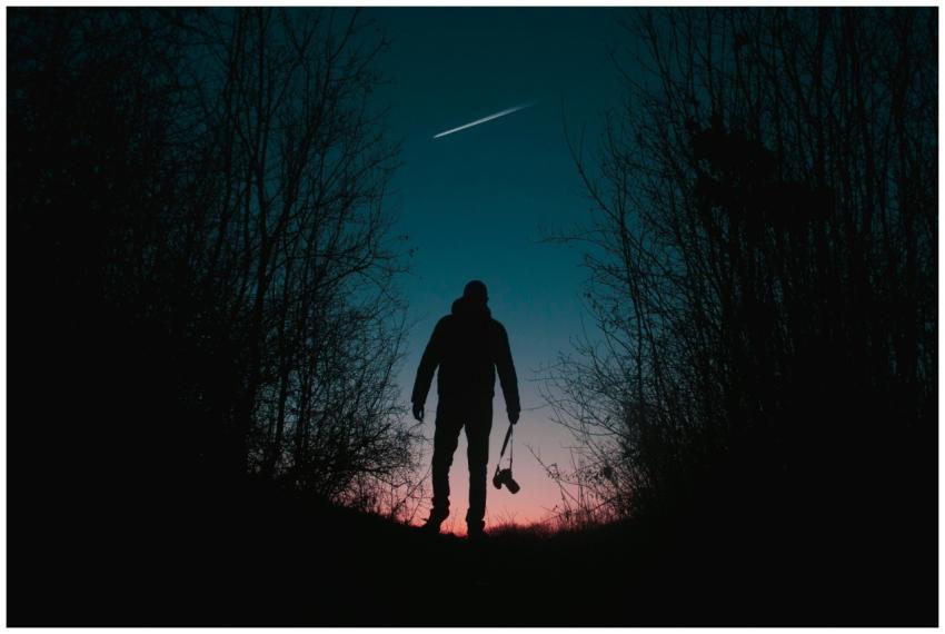 A photographer stands silhouetted in a Kragujevac