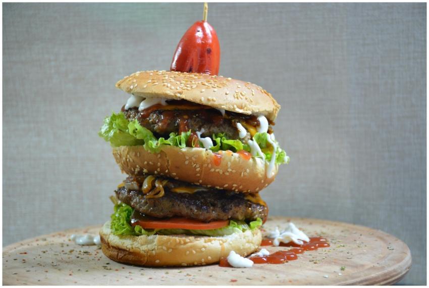 A mouthwatering double cheeseburger with fresh top