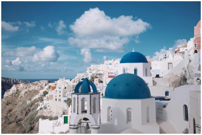 Breathtaking view of Oia's iconic blue-domed churc