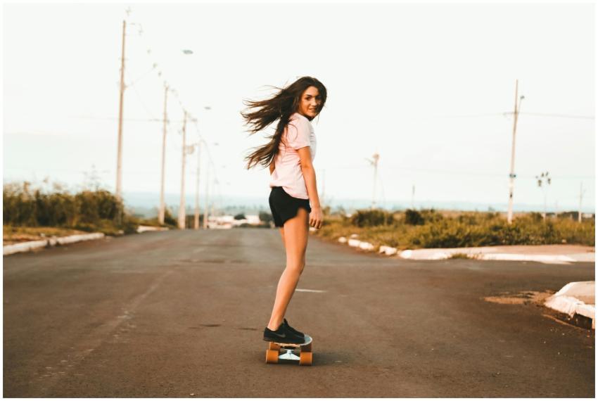 Enjoy a moment of freedom as a young woman skatebo
