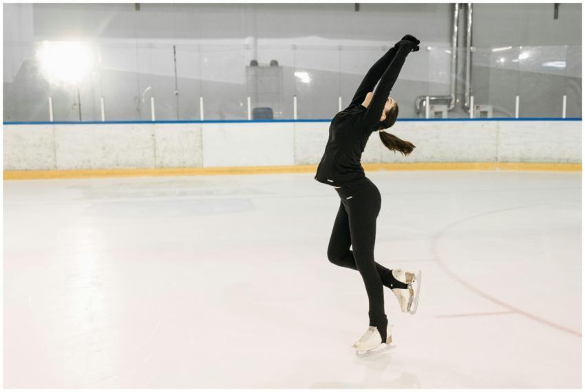 Graceful figure skater executing a pose at an indo