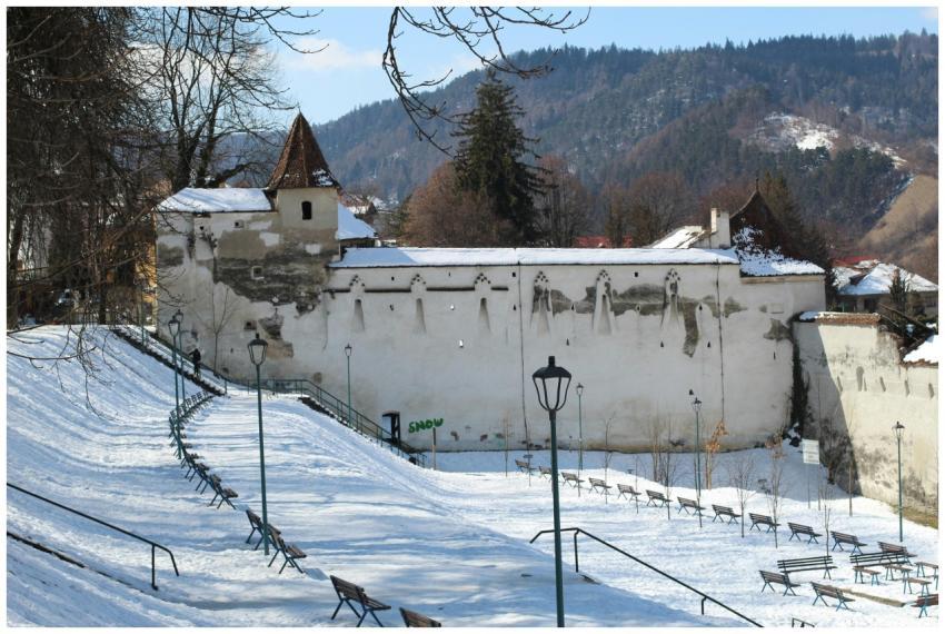 A snowy winter scene at Weaver Bastion in Brasov w