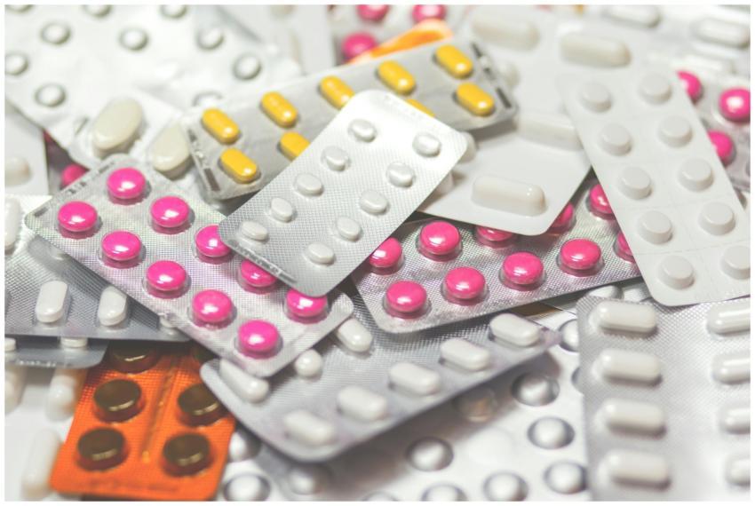 Close-up of various colored pills in blister packs