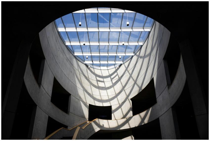 Sunlit interior with a minimalistic glass ceiling