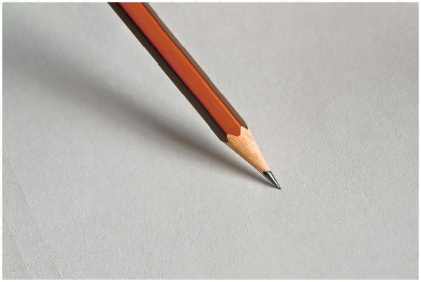Detailed close-up of a wooden pencil resting on wh