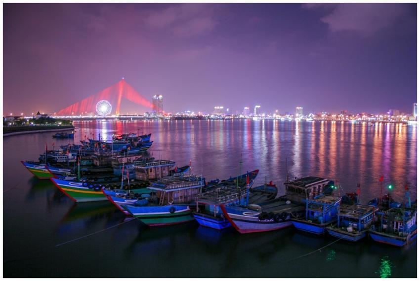 Colorful boats docked at Da Nang's waterfront with