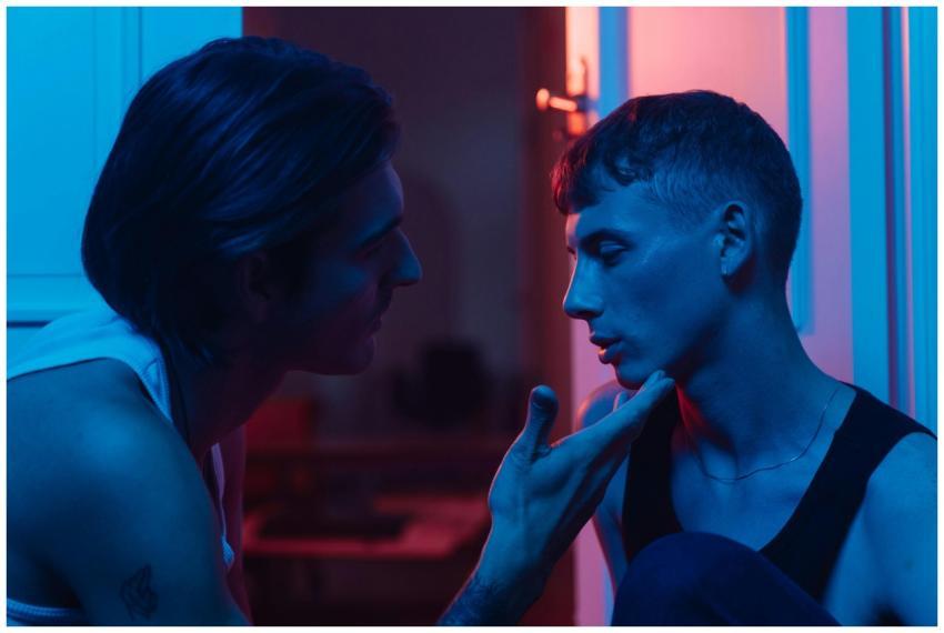 Intimate portrait of two men sharing a moment in a