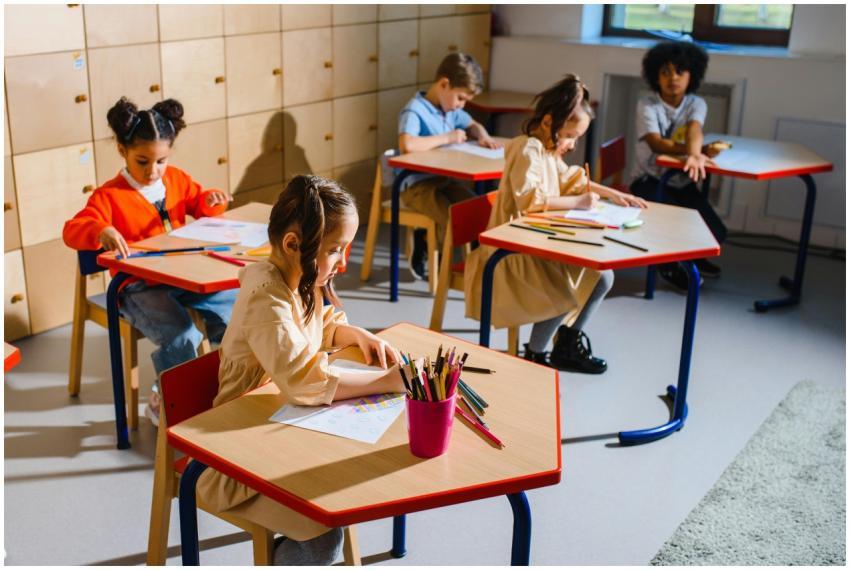 A group of diverse children sitting in a classroom