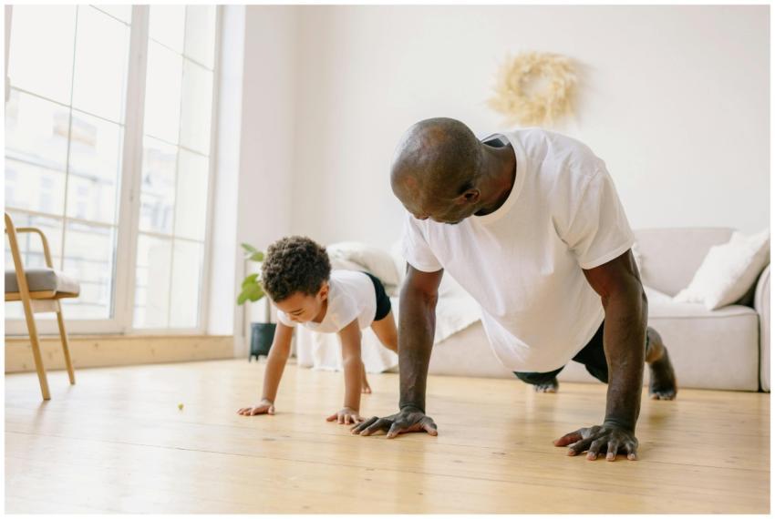 A father and son bonding through exercise indoors,