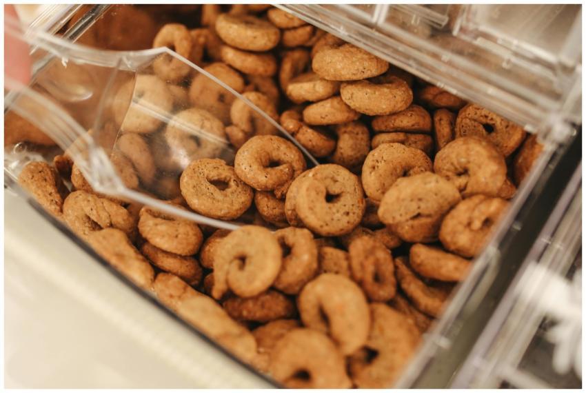 Close-up view of various baked cookies in a bulk c