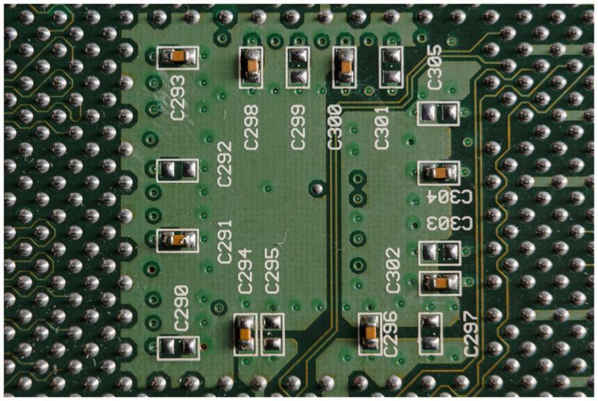 Detailed close-up of a green circuit board featuri